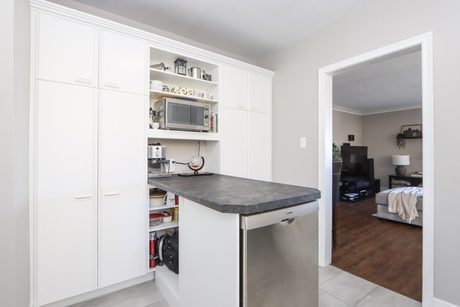 Kitchen peninsula and built-in pantry storage