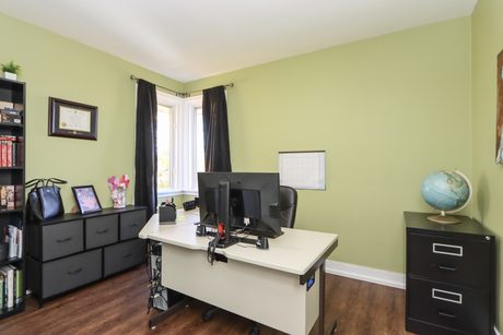 Main-floor bedroom set up as a home office